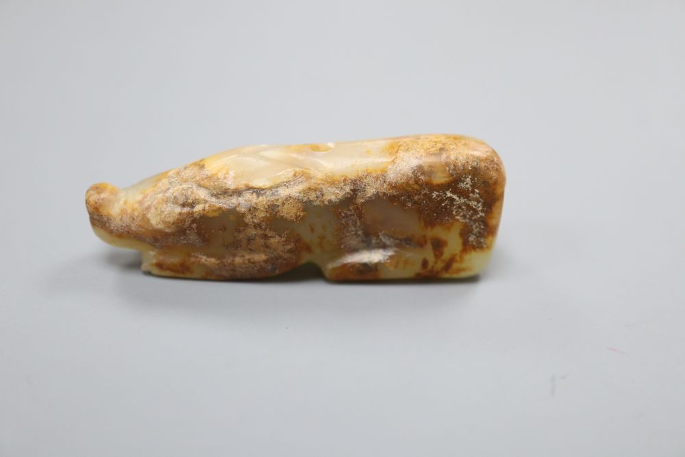 A Chinese celadon and russet jade figure of a pig, Han dynasty or later